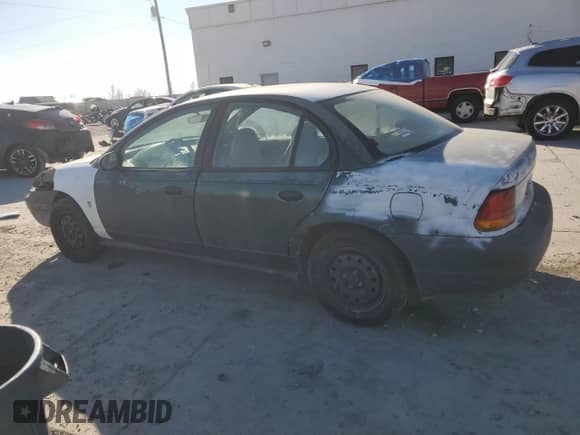 1998 Saturn SL z VIN 1G8ZF5287WZ120978, wystawiony jako Copart lot #43070995 z przebiegiem 279 889 mil mil oraz Szkoda całkowita • Salvage title. Historia ofert i sprzedaży dostępna na DreamBid. Obrazek 2.