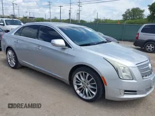 ✅ 2013 Cadillac XTS Platinum • VIN: 2G61U5S3XD9216059 • Lot: 43101311. Listed on IAAI with 161,082 mi. Free auction sales archive from the USA and detailed vehicle history report at DreamBid. Image 1.