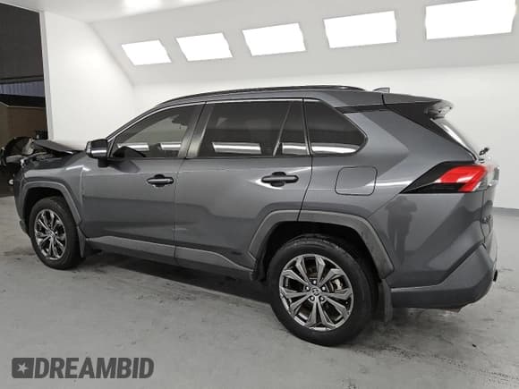 ✅ 2023 Toyota RAV4 Hybrid XLE Premium • VIN: JTMB6RFV9PD085163 • Лот: 84563665. Опубликован ранее на Copart с пробегом 115 711 миль. Бесплатный доступ к архиву аукционных продаж из США и подробный отчёт об истории автомобиля на DreamBid. Изображение 2.