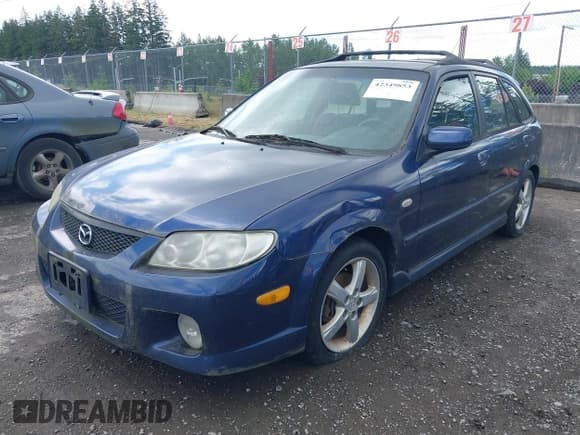 ✅ 2003 Mazda Protege • VIN: JM1BJ245031117566 • Lot: 42349853. Wystawiony na IAAI z przebiegiem 152 784 mil. Bezpłatny archiwum sprzedaży aukcyjnych z USA i szczegółowy raport historii pojazdu na DreamBid. Zdjęcie 2.