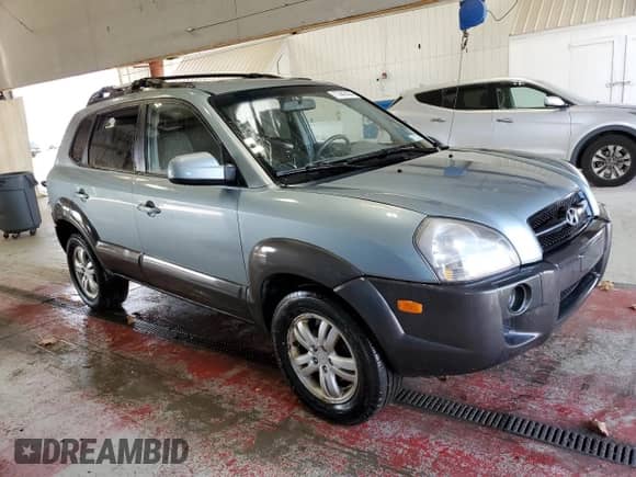2006 Hyundai Tucson GLS with VIN KM8JN72D26U346076, listed as a Copart auction lot 77447474 with 123,993 mi miles and Salvage title. Bid and sale history available at DreamBid. Image 4.