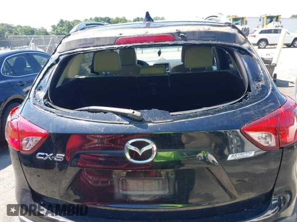 ✅ 2014 Mazda CX-5 Grand Touring • VIN: JM3KE2DY3E0339601 • Lot: 42652114. Wystawiony na IAAI z przebiegiem 153 063 mil. Bezpłatny archiwum sprzedaży aukcyjnych z USA i szczegółowy raport historii pojazdu na DreamBid. Zdjęcie 6.