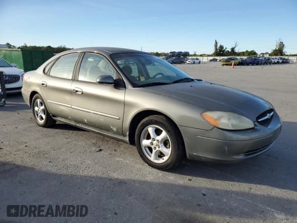 ✅ 2002 Ford Taurus SE Standard • VIN: 1FAFP53U92A164769 • Lot: 91718865. Listed on Copart with 133,695 mi. Free auction sales archive from the USA and detailed vehicle history report at DreamBid. Image 4.