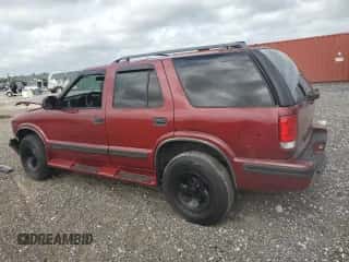 1999 Chevrolet Blazer LS z VIN 1GNCS13W2X2156012, wystawiony jako Copart lot #79730344 z przebiegiem 142 788 mil mil oraz Szkoda całkowita • Salvage title. Historia ofert i sprzedaży dostępna na DreamBid. Obrazek 2.