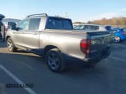 ✅ 2022 Honda Ridgeline RTL • VIN: 5FPYK3F52NB002849 • Lot: 43720277. Listed on IAAI with 71,325 mi. Free auction sales archive from the USA and detailed vehicle history report at DreamBid. Image 3.