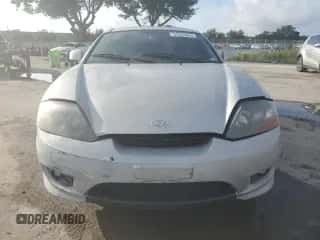 2006 Hyundai Tiburon GS с VIN KMHHM65D76U222358, выставлен на аукционе Copart как лот 64834055 с пробегом 129 477 миль миль и Списание • Salvage title. История ставок и продаж доступна на DreamBid. Изображение 5.