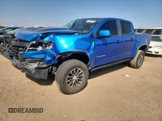 ✅ 2021 Chevrolet Colorado 4WD ZR2 • VIN: 1GCGTEEN4M1145906 • Лот: 71528765. Опубликован ранее на Copart с пробегом 61 663 миль. Бесплатный доступ к архиву аукционных продаж из США и подробный отчёт об истории автомобиля на DreamBid. Изображение 1.