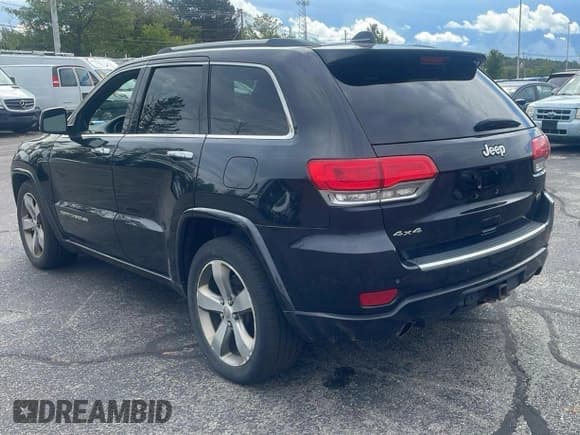 ✅ 2014 Jeep Grand Cherokee Overland • VIN: 1C4RJFCG7EC181541 • Lot: 71310765. Listed on Copart with 226,757 mi. Free auction sales archive from the USA and detailed vehicle history report at DreamBid. Image 3.