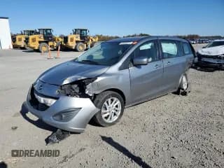 ✅ 2012 Mazda 5 Sport • VIN: JM1CW2BL2C0129652 • Lot: 93080975. Listed on Copart with 220,377 mi. Free auction sales archive from the USA and detailed vehicle history report at DreamBid. Image 1.