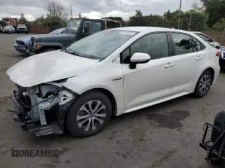 ✅ 2021 Toyota Corolla Hybrid LE • VIN: JTDEAMDE5MJ032166 • Lot: 93130635. Listed on Copart with 63,946 mi. Free auction sales archive from the USA and detailed vehicle history report at DreamBid. Image 1.