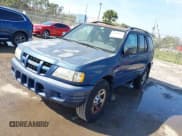 ✅ 2004 Isuzu Rodeo S • VIN: 4S2CK58W944317209 • Lot: 41498160. Listed on IAAI with 114,764 mi. Free auction sales archive from the USA and detailed vehicle history report at DreamBid. Image 2.
