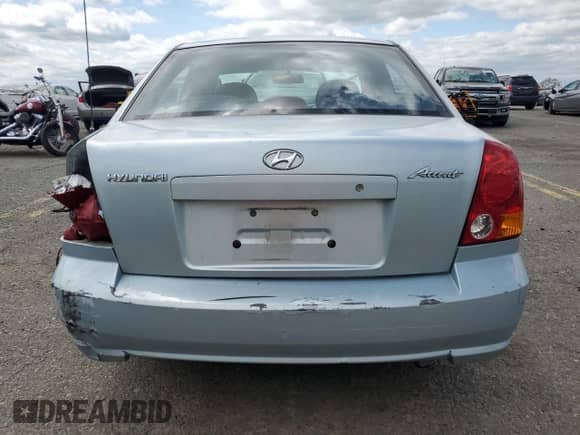 2004 Hyundai Accent GL z VIN KMHCG45C94U574027, wystawiony jako Copart lot #57463905 z przebiegiem 139 595 mil mil oraz Szkoda całkowita • Salvage title. Historia ofert i sprzedaży dostępna na DreamBid. Obrazek 6.