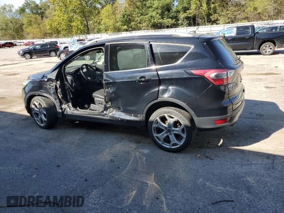 2017 Ford Escape Titanium с VIN 1FMCU9J99HUB85393, выставлен на аукционе Copart как лот 81259365 с пробегом 89 136 миль миль и Списание • Salvage title. История ставок и продаж доступна на DreamBid. Изображение 2.