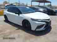 2021 Toyota Camry Hybrid XSE with VIN 4T1K31AK2MU020833, listed as a IAAI auction lot 42520233 with 86,176 mi miles and . Bid and sale history available at DreamBid. Image 1.