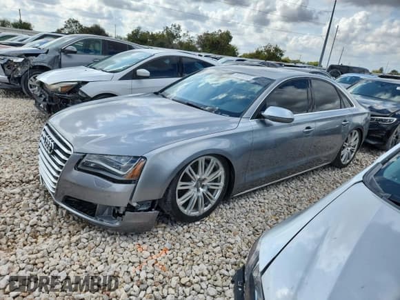 ✅ 2012 Audi A8 • VIN: WAUAVAFD9CN034903 • Lot: 86818705. Wystawiony na Copart z przebiegiem 174 494 mil. Bezpłatny archiwum sprzedaży aukcyjnych z USA i szczegółowy raport historii pojazdu na DreamBid. Zdjęcie 1.