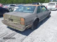 ✅ 1988 Oldsmobile Delta • VIN: 1G3HN14C7JW410839 • Lot: 42691147. Listed on IAAI with 124,911 mi. Free auction sales archive from the USA and detailed vehicle history report at DreamBid. Image 4.