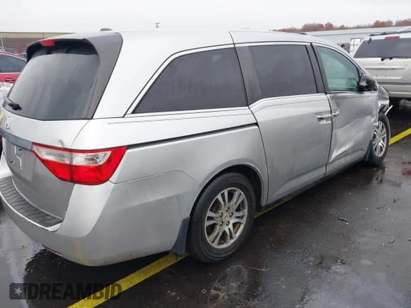 ✅ 2012 Honda Odyssey EX-L • VIN: 5FNRL5H61CB030022 • Lot: 43730404. Listed on IAAI with 153,349 mi. Free auction sales archive from the USA and detailed vehicle history report at DreamBid. Image 4.