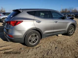 ✅ 2018 Hyundai Santa Fe 2.4L • VIN: 5NMZTDLB4JH090614 • Лот: 68172312. Опубликован ранее на Copart с пробегом 64 828 миль. Бесплатный доступ к архиву аукционных продаж из США и подробный отчёт об истории автомобиля на DreamBid. Изображение 3.