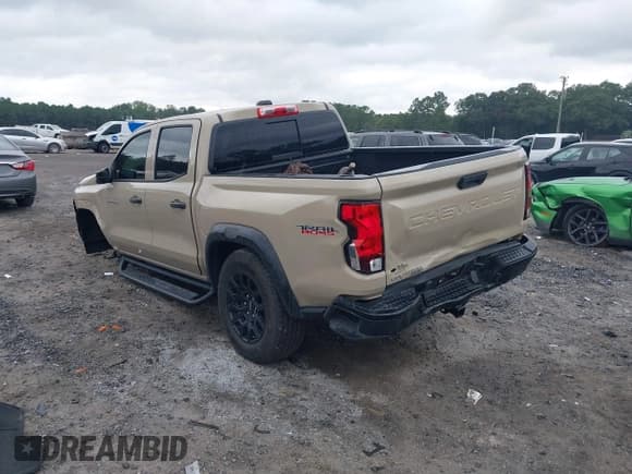 ✅ 2023 Chevrolet Colorado 4WD Trail Boss • VIN: 1GCPTEEK6P1143357 • Lot: 43328302. Listed on IAAI with 35,464 mi. Free auction sales archive from the USA and detailed vehicle history report at DreamBid. Image 3.
