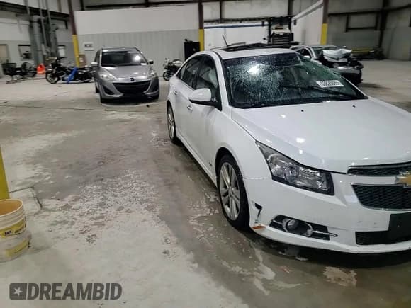 ✅ 2014 Chevrolet Cruze LTZ • VIN: 1G1PG5SB5E7203818 • Lot: 83825085. Listed on Copart with 94,394 mi. Free auction sales archive from the USA and detailed vehicle history report at DreamBid. Image 13.