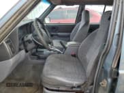 ✅ 1998 Jeep Cherokee Sport • VIN: 1J4FJ68S9WL241184 • Lot: 87360684. Listed on Copart with 257,954 mi. Free auction sales archive from the USA and detailed vehicle history report at DreamBid. Image 7.