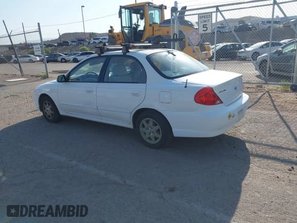 ✅ 2002 Kia Spectra • VIN: KNAFB121825132605 • Lot: 42512524. Listed on IAAI with 132,897 mi. Free auction sales archive from the USA and detailed vehicle history report at DreamBid. Image 3.