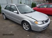 ✅ 2003 Mazda Protege DX • VIN: JM1BJ225330217847 • Лот: 43838287. Опубликован ранее на IAAI с пробегом 276 700 миль. Бесплатный доступ к архиву аукционных продаж из США и подробный отчёт об истории автомобиля на DreamBid. Изображение 1.