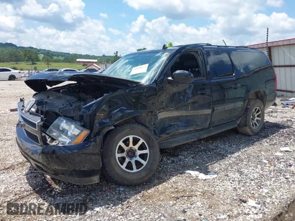 2014 Chevrolet Suburban LT with VIN 1GNSKJE77ER233057, listed as a IAAI auction lot 42696074 with 151,658 mi miles and . Bid and sale history available at DreamBid. Image 21.