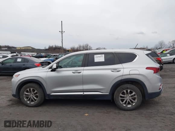 ✅ 2019 Hyundai Santa Fe SE • VIN: 5NMS2CAD7KH054274 • Lot: 43694931. Listed on IAAI with 96,329 mi. Free auction sales archive from the USA and detailed vehicle history report at DreamBid. Image 14.