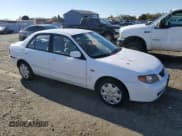 ✅ 2002 Mazda Protege DX • VIN: JM1BJ225821620599 • Lot: 80957944. Wystawiony na Copart z przebiegiem 190 064 mil. Bezpłatny archiwum sprzedaży aukcyjnych z USA i szczegółowy raport historii pojazdu na DreamBid. Zdjęcie 4.