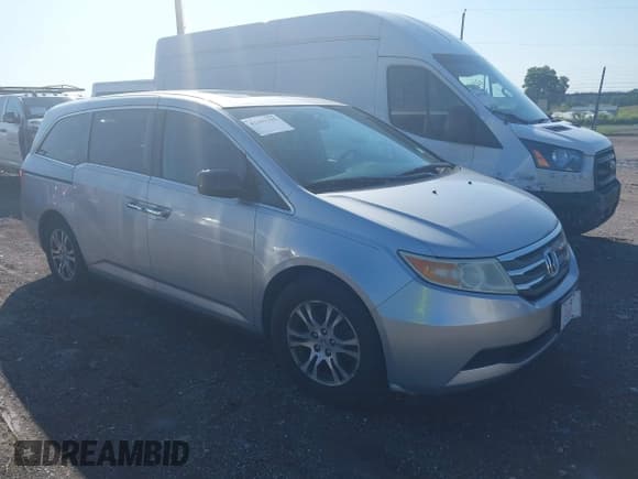 ✅ 2011 Honda Odyssey EX-L • VIN: 5FNRL5H6XBB057590 • Lot: 42481395. Listed on IAAI with 206,000 mi. Free auction sales archive from the USA and detailed vehicle history report at DreamBid. Image 1.
