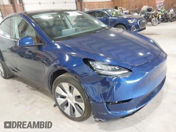 ✅ 2023 Tesla Model Y Long Range • VIN: 7SAYGDEE0PA124551 • Lot: 42331624. Listed on IAAI with 27,828 mi. Free auction sales archive from the USA and detailed vehicle history report at DreamBid. Image 6.