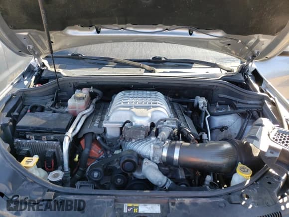 ✅ 2018 Jeep Grand Cherokee • VIN: NJ1454E • Lot: 48051693. Listed on Copart with 66,894 mi. Free auction sales archive from the USA and detailed vehicle history report at DreamBid. Image 12.