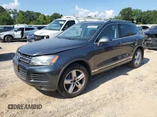 ✅ 2013 Volkswagen Touareg Sport • VIN: WVGEP9BP2DD006019 • Lot: 65858835. Listed on Copart with 144,246 mi. Free auction sales archive from the USA and detailed vehicle history report at DreamBid. Image 1.