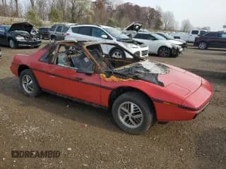 ✅ 1984 Pontiac Fiero • VIN: 1G2AF37R2EP218100 • Lot: 77358284. Wystawiony na Copart z przebiegiem Nie podano. Bezpłatny archiwum sprzedaży aukcyjnych z USA i szczegółowy raport historii pojazdu na DreamBid. Zdjęcie 4.
