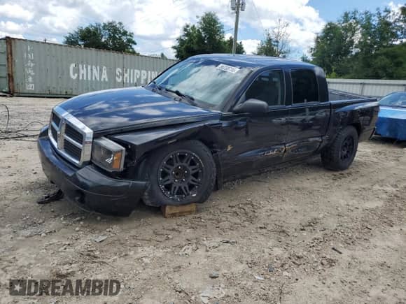 2006 Dodge Dakota SLT with VIN 1D7HE48K66S687229, listed as a Copart auction lot 56238735 with 148,785 mi miles and Salvage title. Bid and sale history available at DreamBid. Image 1.