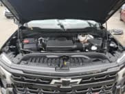 ✅ 2024 Chevrolet Silverado 1500 LT Trail Boss • VIN: 3GCUDFEL8RG262160 • Lot: 64644755. Wystawiony na Copart z przebiegiem 9 866 mil. Bezpłatny archiwum sprzedaży aukcyjnych z USA i szczegółowy raport historii pojazdu na DreamBid. Zdjęcie 11.