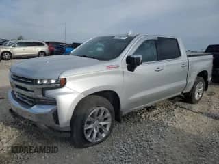 2020 Chevrolet Silverado 1500 LTZ with VIN 1GCUYGEL2LZ241256, listed as a Copart auction lot 52596075 with 111,217 mi miles and Salvage title. Bid and sale history available at DreamBid. Image 1.