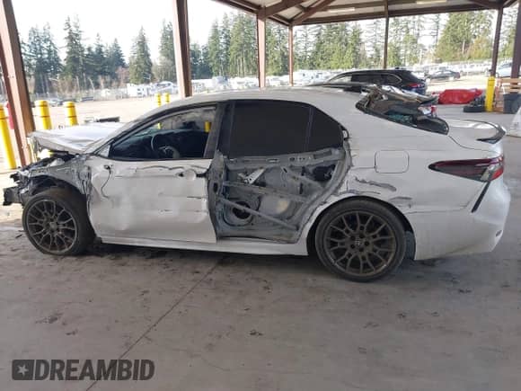 2023 Toyota Camry SE with VIN 4T1G11BK2PU099094, listed as a IAAI auction lot 41403372 with 57,261 mi miles and . Bid and sale history available at DreamBid. Image 14.