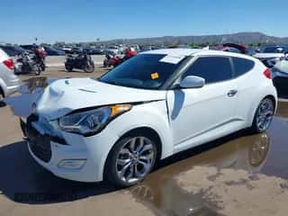 2014 Hyundai Veloster z VIN KMHTC6AD4EU213537, wystawiony jako IAAI lot #43358808 z przebiegiem 54 973 mil mil oraz . Historia ofert i sprzedaży dostępna na DreamBid. Obrazek 2.