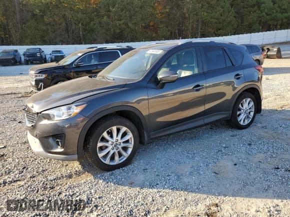 ✅ 2015 Mazda CX-5 Grand Touring • VIN: JM3KE4DY5F0536458 • Лот: 90344905. Опубликован ранее на Copart с пробегом 143 896 миль. Бесплатный доступ к архиву аукционных продаж из США и подробный отчёт об истории автомобиля на DreamBid. Изображение 1.