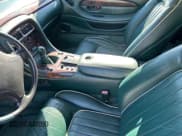 ✅ 1997 Aston Martin DB7 • VIN: SCFAA4129VK20114 • Lot: 83816704. Wystawiony na Copart z przebiegiem 28 552 mil. Bezpłatny archiwum sprzedaży aukcyjnych z USA i szczegółowy raport historii pojazdu na DreamBid. Zdjęcie 5.