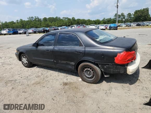 ✅ 1999 Mazda 626 ES • VIN: 1YVGF22C4X5820864 • Lot: 59305085. Listed on Copart with Not provided. Free auction sales archive from the USA and detailed vehicle history report at DreamBid. Image 2.