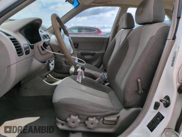 2002 Hyundai Accent GL z VIN KMHCG45C82U358523, wystawiony jako Copart lot #48247575 z przebiegiem 164 869 mil mil oraz Szkoda całkowita • Salvage title. Historia ofert i sprzedaży dostępna na DreamBid. Obrazek 7.