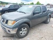 ✅ 2005 Nissan Frontier LE • VIN: 1N6AD07U45C451534 • Lot: 42643704. Listed on IAAI with 233,237 mi. Free auction sales archive from the USA and detailed vehicle history report at DreamBid. Image 2.