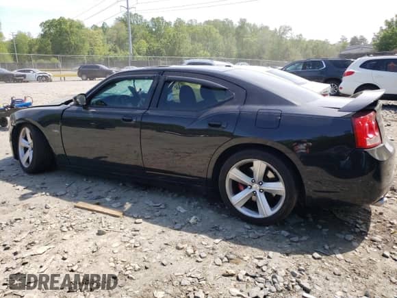 2009 Dodge Charger SRT-8 с VIN 2B3LA73W39H597691, выставлен на аукционе Copart как лот 55094195 с пробегом 156 283 миль миль и Списание • Salvage title. История ставок и продаж доступна на DreamBid. Изображение 2.