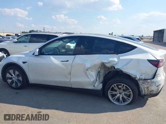 ✅ 2023 Tesla Model Y Long Range • VIN: 7SAYGDEE5PA168223 • Lot: 43341688. Listed on IAAI with 59,137 mi. Free auction sales archive from the USA and detailed vehicle history report at DreamBid. Image 6.