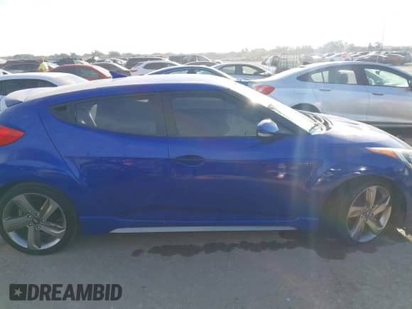 2014 Hyundai Veloster Turbo z VIN KMHTC6AE4EU184467, wystawiony jako IAAI lot #43457856 z przebiegiem 149 546 mil mil oraz . Historia ofert i sprzedaży dostępna na DreamBid. Obrazek 14.