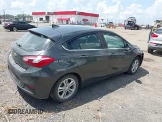 ✅ 2018 Chevrolet Cruze LT • VIN: 3G1BE6SM1JS654442 • Lot: 42827187. Listed on IAAI with 108,411 mi. Free auction sales archive from the USA and detailed vehicle history report at DreamBid. Image 4.