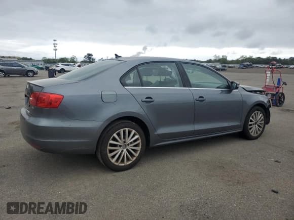 ✅ 2014 Volkswagen Jetta SEL • VIN: 3VWL17AJ8EM406197 • Lot: 57777195. Listed on Copart with 107,120 mi. Free auction sales archive from the USA and detailed vehicle history report at DreamBid. Image 3.